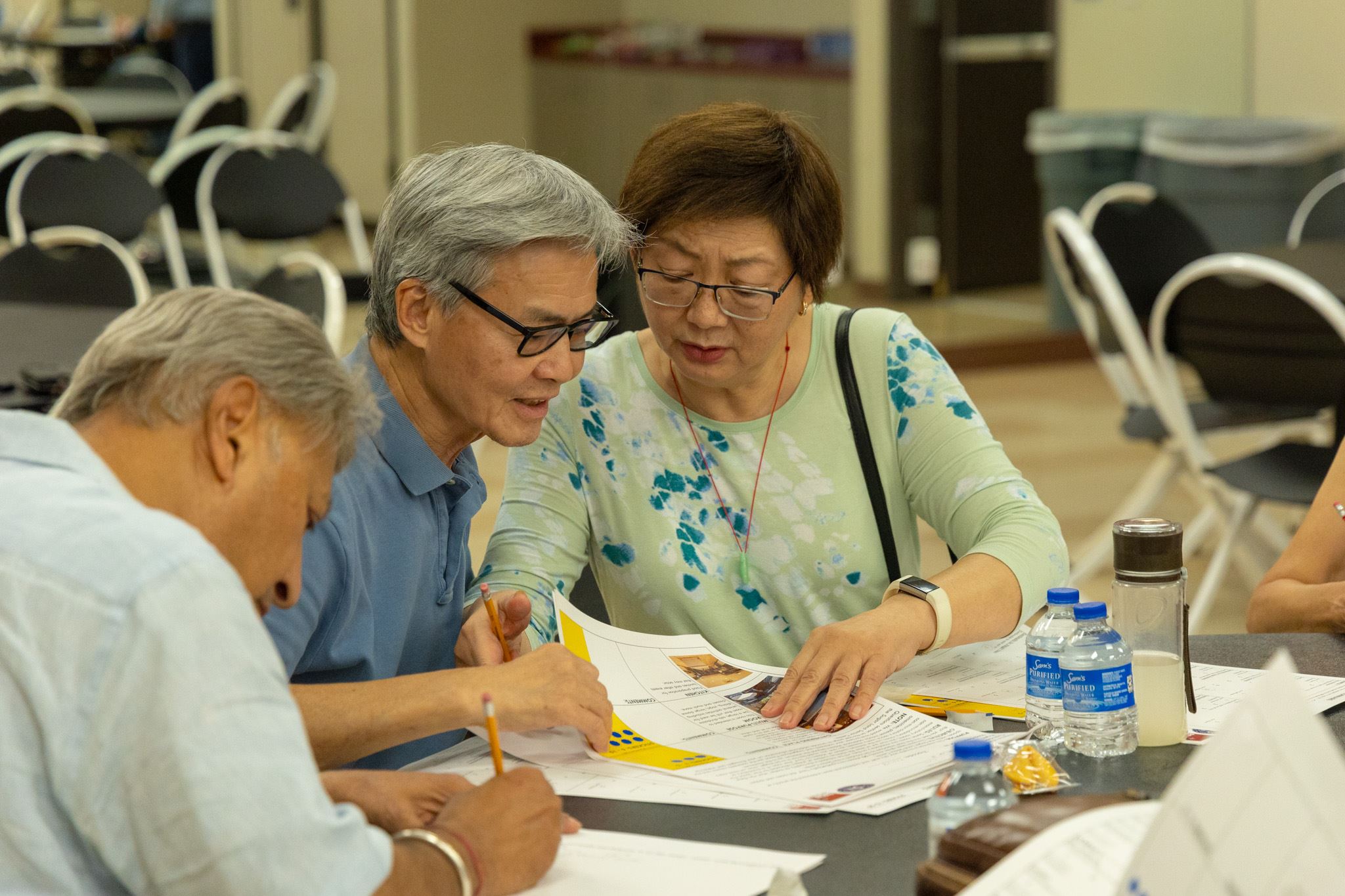Seniors receiving assistance at a Senior Center Open House
