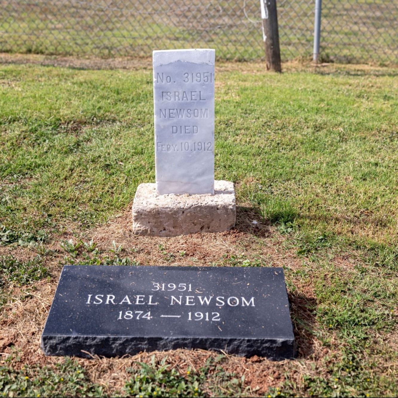 Post-Restoration of Israel Newsom's gravestone and pillow marker in 2023