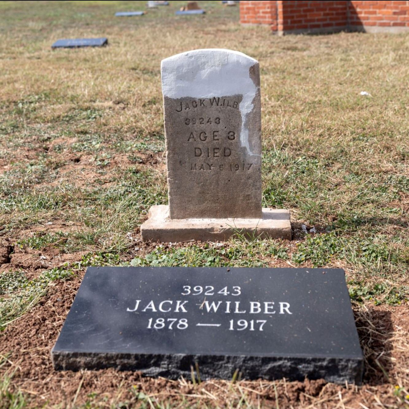 Post-Restoration of Jack Wilber's gravestone and pillow marker in 2023