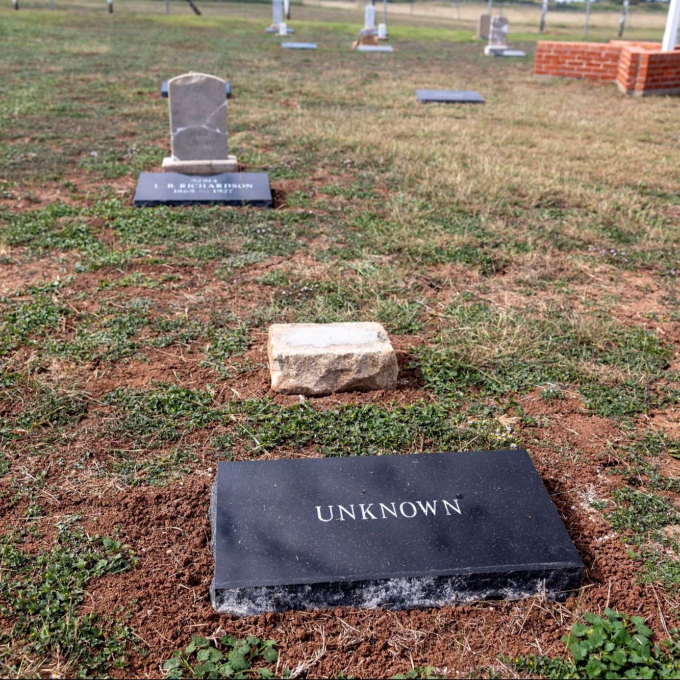 Post-Restoration of Unknown (Grave 9) gravestone and pillow marker in 2023
