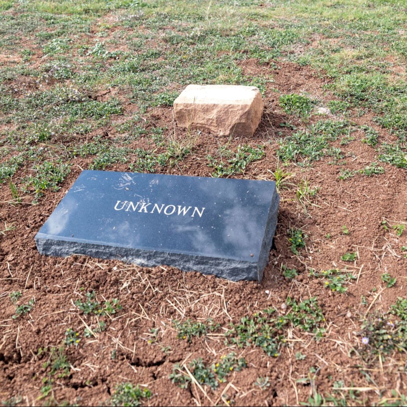 Post-Restoration of Unknown (Grave 23) gravestone and pillow marker in 2023