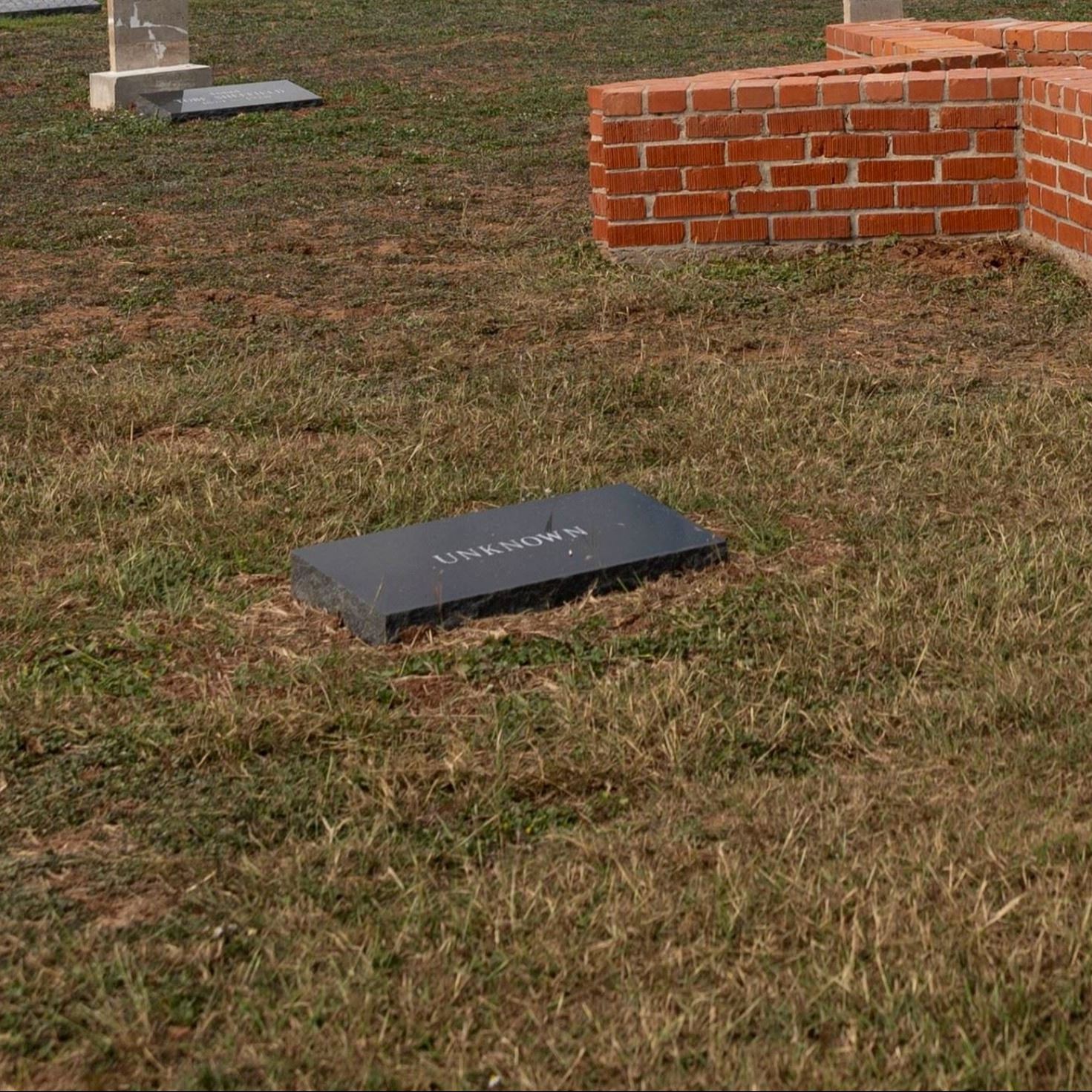Post-Restoration of Unknown (Grave 35) gravestone and pillow marker in 2023